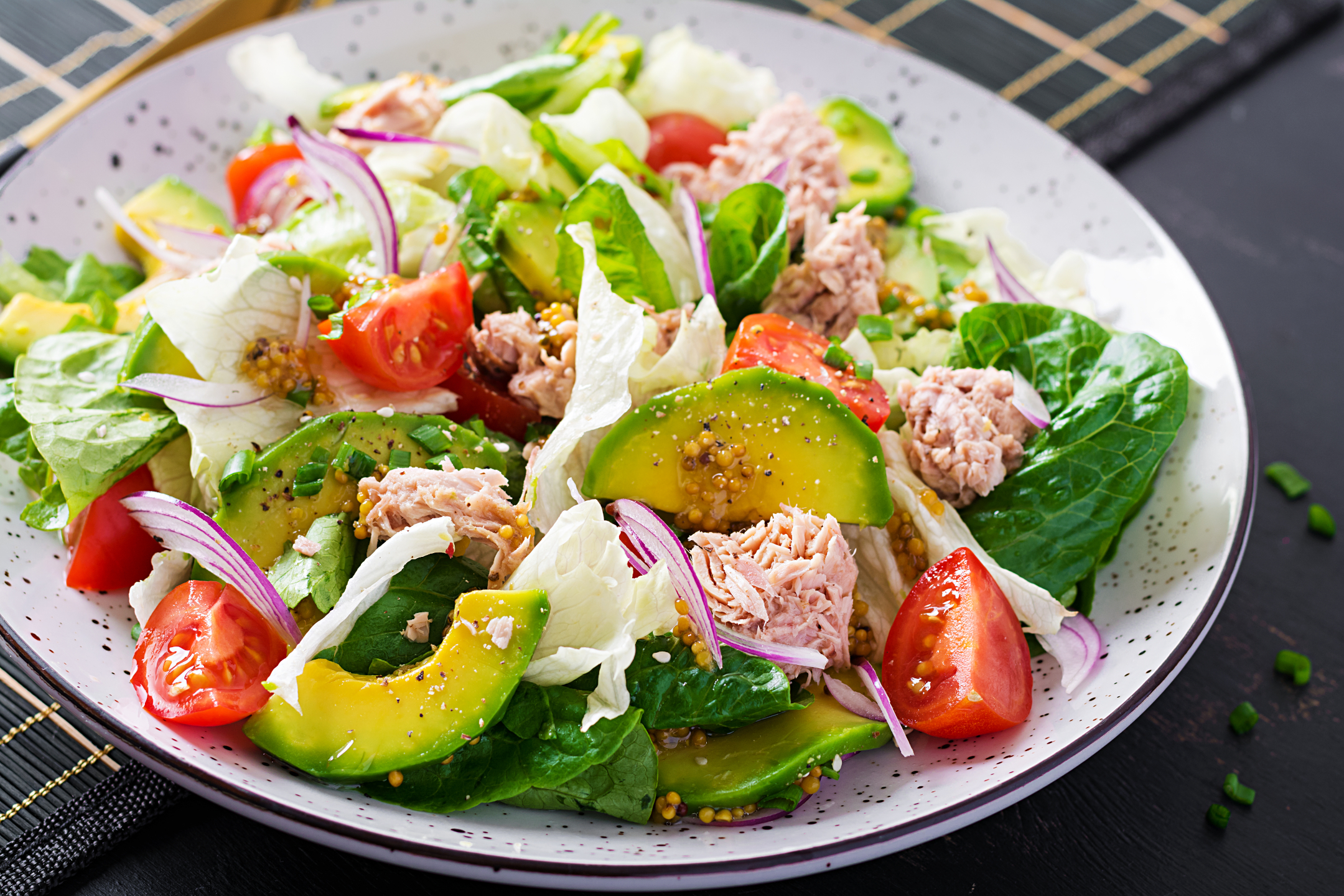 Tuna fish salad with lettuce, cherry tomatoes, avocado, red onions, health food French cuisine